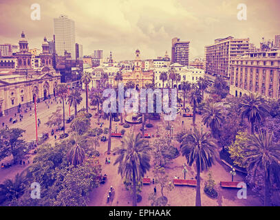 Vintage stylized photo of Santiago de Chile downtown, Plaza de Armas where modern skyscrapers mix with historic buildings, Chile Stock Photo