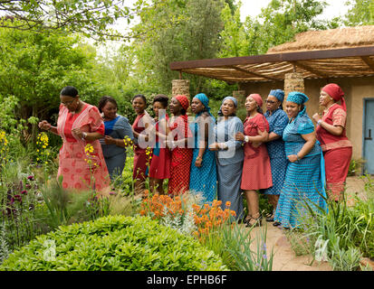 London, UK. 18th May, 2015. The Basotho Diaspora Choir performing in traditional dress at the Sentebale-Hope in Vulnerablity Garden at The RHS Chelsea Flower Show. Credit:  Ellen Rooney/Alamy Live News Stock Photo