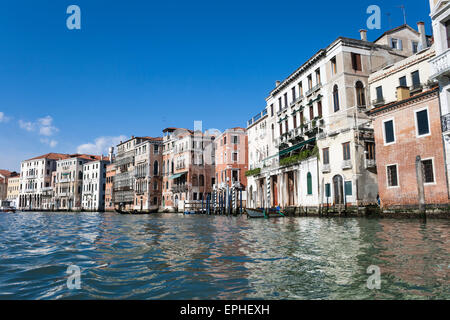 Houses along the Grand Canal near Rialto Bridge in Venice, Italy Stock Photo