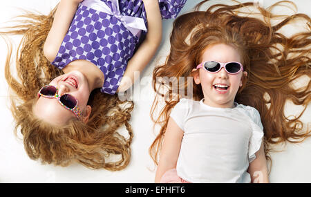Pretty little girls having a great fun together Stock Photo