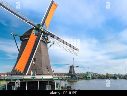Holland windmills at De Zaanse Schans. Spinning oil mill windmill. Working old Dutch windmills along the river De Zaan.