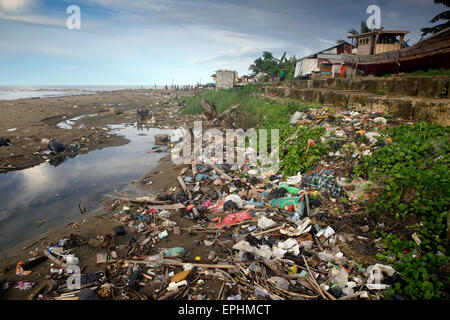 Plastic trash and other garbage on urban beach in Sumatra, Indonesia Stock Photo