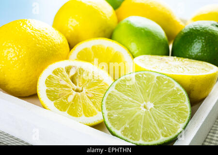 Organic fresh citrus fruit on a white tray. Stock Photo