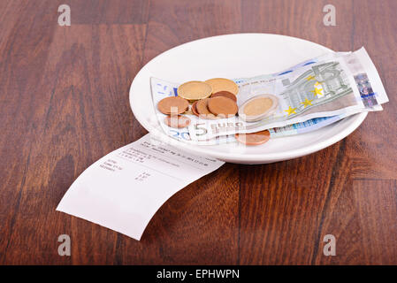 Tip on a restaurant table Stock Photo