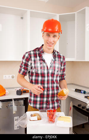 repairman dines Stock Photo