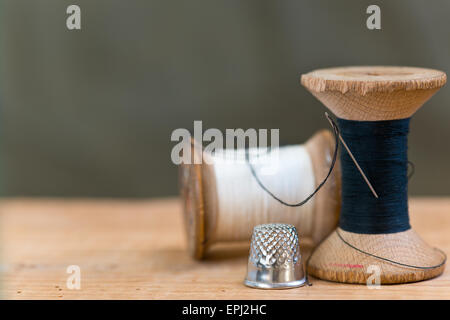 two spools of thread with thimble Stock Photo