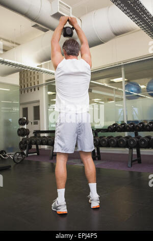 Fit man using kettlebells in his workout Stock Photo