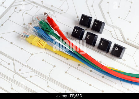 IT HELP, Assistance - HELP made of keyboard keys with colourful network cables on white circuit board background Stock Photo