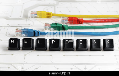 IT HELP, Assistance - HELP made of keyboard keys with colourful network cables on white circuit board background Stock Photo