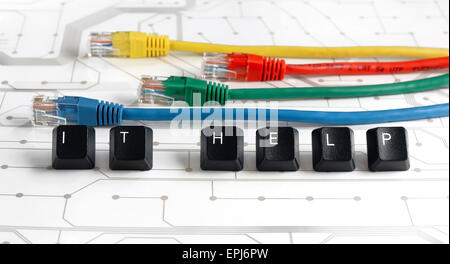 IT HELP, Assistance - HELP made of keyboard keys with colourful network cables on white circuit board background Stock Photo