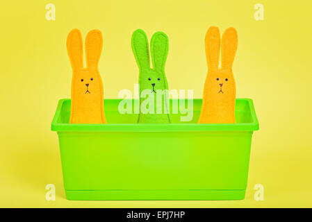 Three easter Bunnies in flower pot Stock Photo