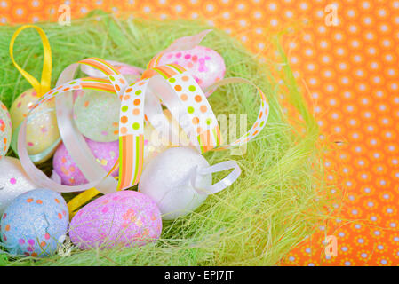 Easter ribbon and eggs in nest Stock Photo
