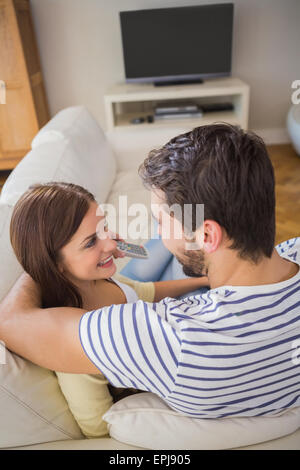 Cute couple relaxing on couch Stock Photo