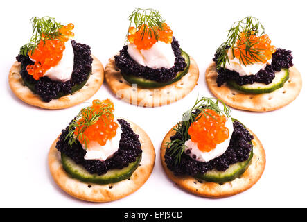 Caviar Appetizer served on crackers isolated on white Stock Photo