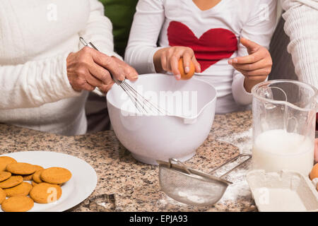 Multi-generation family baking together Stock Photo