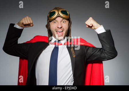Superman concept with man in red cover Stock Photo