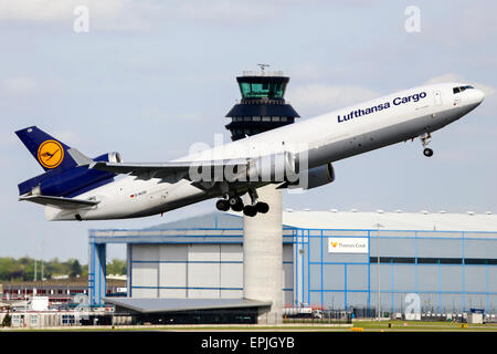 Lufthansa Cargo McDonnell Douglas MD-11 climbs away from runway 05L at Manchester airport. Stock Photo