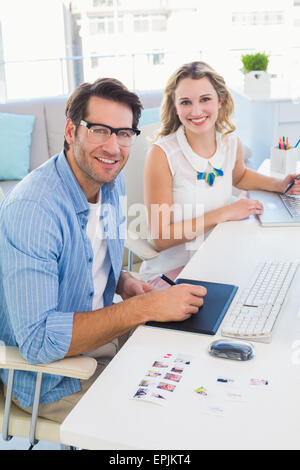 Casual photo editors using graphics tablet Stock Photo