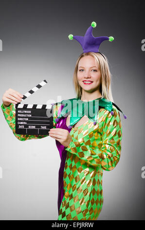 Clown with movie clapper board Stock Photo