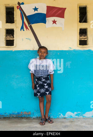 Panama, San Blas Islands, Mamitupu, Kuna Girl In A School In Front Of A Painting Of The Panama Flag Stock Photo