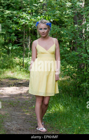 https://l450v.alamy.com/450v/epkhmf/young-beautiful-lady-in-yellow-dress-in-epkhmf.jpg