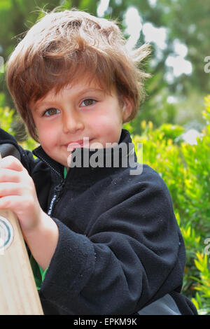 The blond boy climbed a wooden ladders Stock Photo
