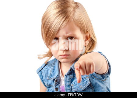 Portrait of a young angry girl pointing up Stock Photo