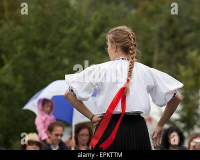 Rear view of woman dancer in traditional Polish dress Stock Photo
