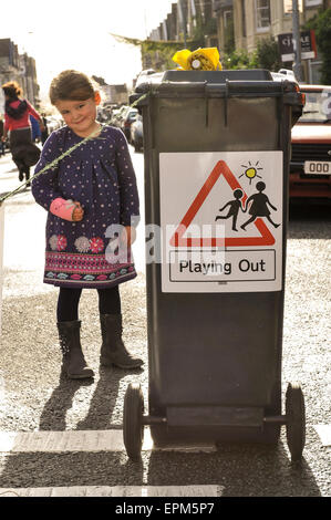 Children safely playing in a closed to traffic street in Bristol as part of the Playing Out project. Stock Photo