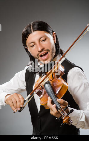 Musician plays cello isolated on white Stock Photo