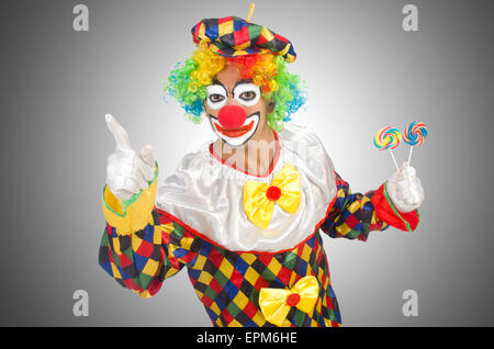 Clown with lollipops isolated on white Stock Photo - Alamy