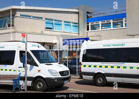 Patient Transport vehicles outside Outpatients Department entrance of St Richards Hospital Chichester Stock Photo