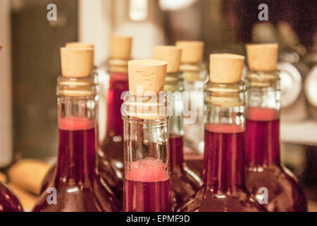 Fresh homemade juice, in bottles, on table Stock Photo