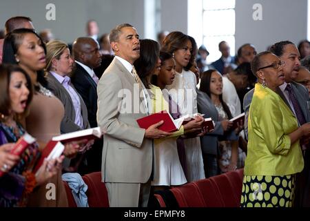 U.S. President Barack Obama along with First Lady Michelle Obama, and daughters Malia and Sasha, attend Easter service at 19th Street Baptist Church April 20,  2014 in Washington, DC. Stock Photo