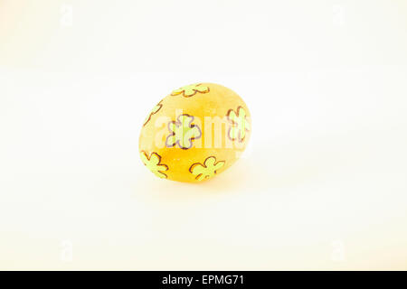 One orange easter egg, isolated on white background Stock Photo