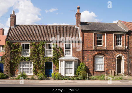 Nos 14 and 12 Church Street, Spilsby, Lincolnshire, England, UK. That on the right is the old Grammar School built circa 1800. Stock Photo