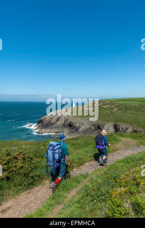 Hikers along the Pembrokeshire coastal path near Porthgain. Pembrokeshire. Wales. Cymru. UK Stock Photo