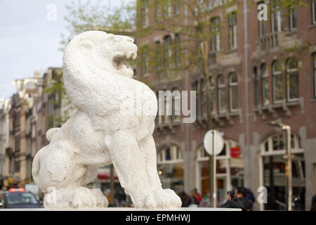 Stone guardian lion in Dam Square Amsterdam Stock Photo