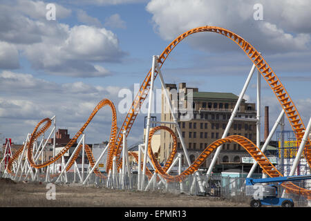 The Thunderbolt roller coaster against the blue sky with puffy clouds at Coney Island, Brooklyn, NY. Stock Photo