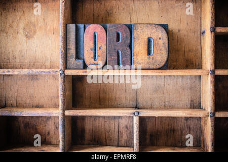 The word LORD written in vintage wooden letterpress type in a wooden type drawer. Stock Photo