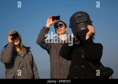 People watching the specacular partial solar eclipse, 20th March, 2015, on moorland, Gower Peninsular, Wales, UK Stock Photo