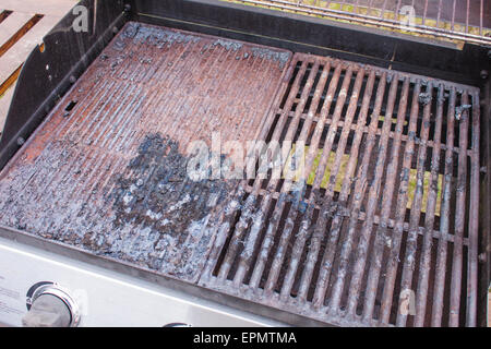 A dirty grill, full of old food and rust Stock Photo