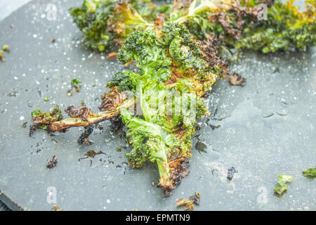 Deep fried kale, on a stone plate Stock Photo