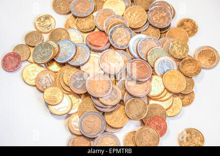 A pile of euro coins, on a white table Stock Photo