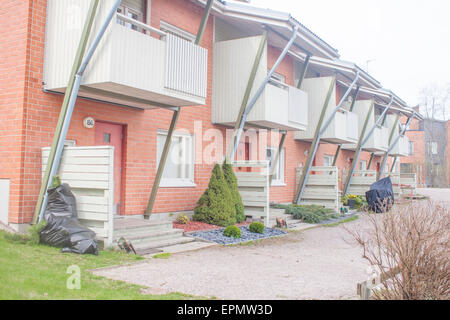A row of red houses, near each other Stock Photo