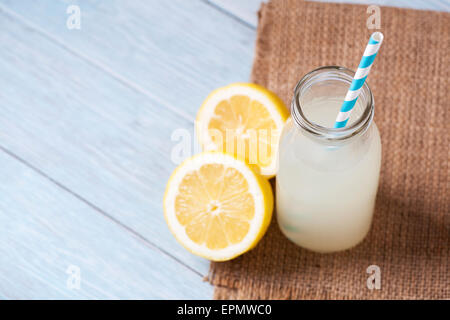 Traditional cloudy lemonade in glass bottles Stock Photo