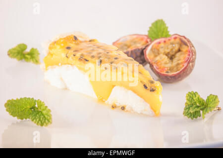 Passion mango meringue cake, on white background Stock Photo