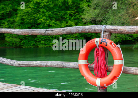 Plastic orange saving belt in plitvice national park Stock Photo