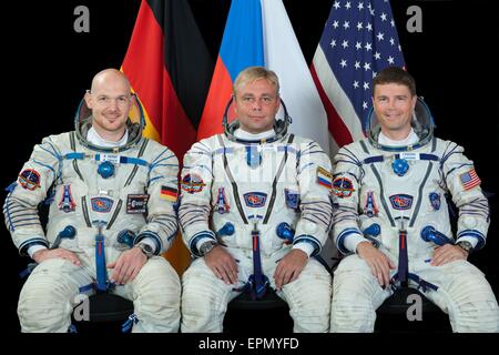 International Space Station Expedition 40 crew members ESA astronaut Alexander Gerst (left), Soyuz commander Max Suraev and NASA astronaut Reid Wiseman (right) pose for an official portrait at the Gagarin Cosmonaut Training Center August 22, 2013 in Star City, Russia. Stock Photo