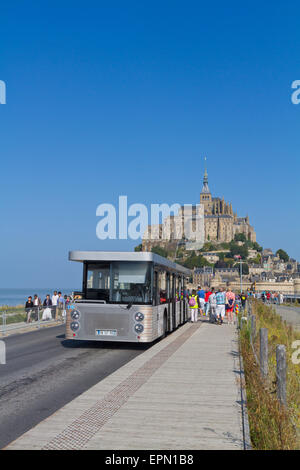 The new shuttle bus arrives at Mont St Michel Stock Photo